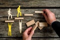 Businessman with silhouette people helping others climbing wooden stairs