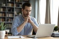 Businessman sit at desk looks at laptop read media news Royalty Free Stock Photo