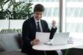 Businessman reading paper financial documentation feels excited Royalty Free Stock Photo