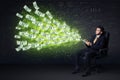 Businessman sitting in chair holding tablet with dollar bills co Royalty Free Stock Photo