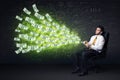 Businessman sitting in chair holding tablet with dollar bills co Royalty Free Stock Photo