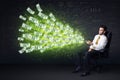 Businessman sitting in chair holding tablet with dollar bills co Royalty Free Stock Photo