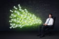 Businessman sitting in chair holding tablet with dollar bills co Royalty Free Stock Photo