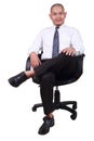 Businessman Sitting on Chair Isolated on White Royalty Free Stock Photo