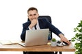 businessman sitting on chair at table and resting, using laptop Royalty Free Stock Photo