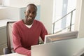 Businessman Sitting At Computer Desk