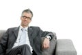 Businessman sitting on couch Royalty Free Stock Photo