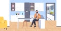 Businessman sitting at counter man using smartphone mobile app communication concept modern coffee point kitchen
