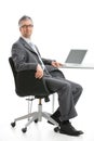 Businessman sitting at desk Royalty Free Stock Photo