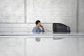 Businessman Sitting In Front Of Computer Using Telephone Royalty Free Stock Photo