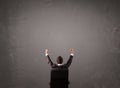 Businessman sitting in front of a wall with copy space Royalty Free Stock Photo