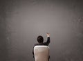 Businessman sitting in front of a wall with copy space Royalty Free Stock Photo