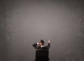 Businessman sitting in front of a wall with copy space Royalty Free Stock Photo