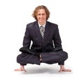 Businessman sitting in full lotus position.