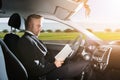 Businessman Sitting Inside Self Driving Car Royalty Free Stock Photo