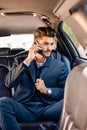 Businessman sitting in limousine Royalty Free Stock Photo