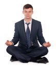 Businessman sitting in lotus position