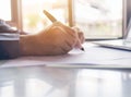 Businessman sitting at office desk signing a contract close up Royalty Free Stock Photo