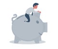 Businessman sitting on a piggy bank. Banking concept.