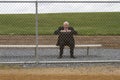 Businessman Sitting on Sidelines