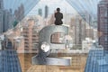 Businessman sitting on silver pound symbol with lock