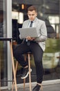 Businessman sitting at thecafe with laptop Royalty Free Stock Photo