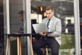 Businessman sitting at thecafe with laptop Royalty Free Stock Photo