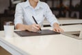 Businessman sitting to working at office desk have a coffee cup beside for efficient work problems and concepts.