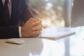 Businessman sitting to working at office desk have a coffee cup beside for efficient work problems and concepts.