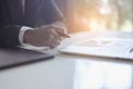 Businessman sitting to working at office desk have a coffee cup beside for efficient work problems and concepts.