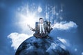 Businessman sitting on top of the world with data server Royalty Free Stock Photo