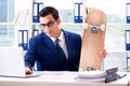 The businessman with skateboard in office