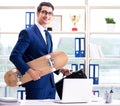 Businessman with skateboard in office