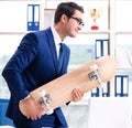 Businessman with skateboard in office