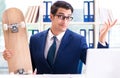 Businessman with skateboard in office