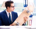 Businessman with skateboard in office