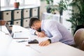 Businessman sleep at the desk in the modern office Royalty Free Stock Photo