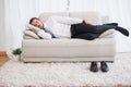 Businessman sleeping on couch after long day Royalty Free Stock Photo