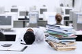 Businessman sleeping at desk Royalty Free Stock Photo