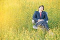 Businessman sleeping in flower field Royalty Free Stock Photo