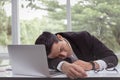 Businessman sleeping in office.