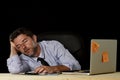 Businessman sleeping wasted tired at office computer desk in long hours of work Royalty Free Stock Photo