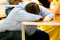 Businessman sleeps on desk after Tired overworked Royalty Free Stock Photo