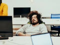 Businessman slepping on chair in business company office