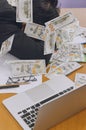 Businessman slepping with heap of dollar money in office