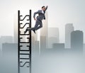 Businessman slipping from the top of ladder