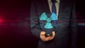 Businessman with smartphone and nuclear symbol hologram concept