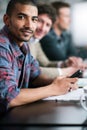 Businessman, smartphone and portrait in office with coworkers, business meeting and collaboration in startup project