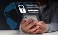 A businessman with a smartphone is safe in his account.Hacking a Phishing mobile phone with a password to gain access to a