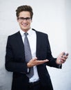 Businessman, smartphone and smile for networking, communication and corporate clothes. Offering, professional and Royalty Free Stock Photo